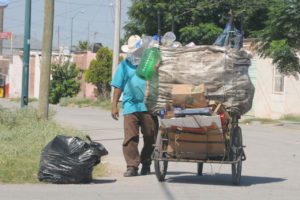 Local worker collecting garbage in Mexico